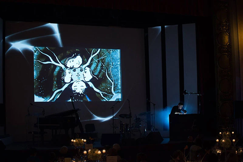 Projected sand art performance